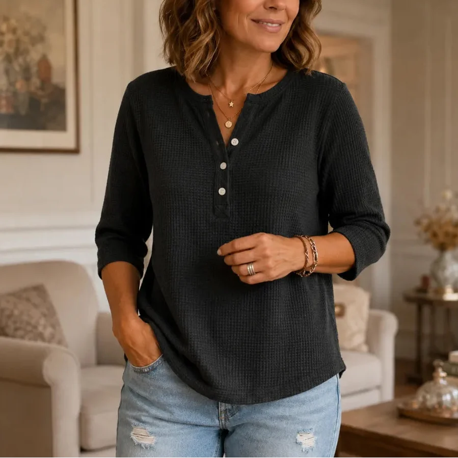 Women's waffle-textured Henley top with button placket and three-quarter sleeves