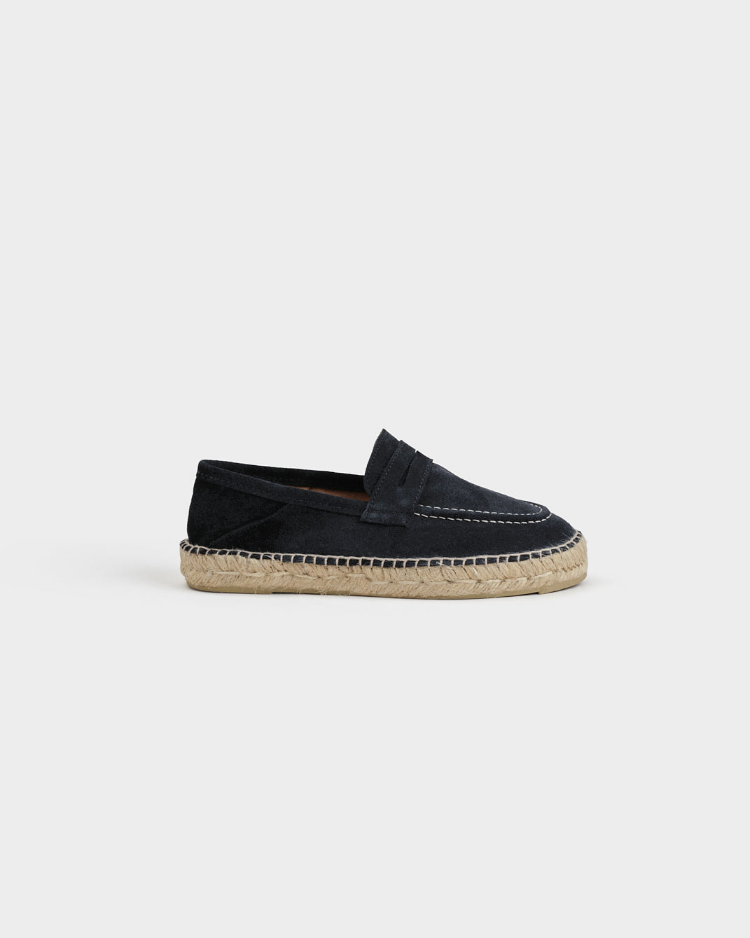 Black suede loafers with woven espadrille sole and white stitching