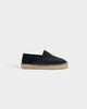 Black suede loafers with woven espadrille sole and white stitching