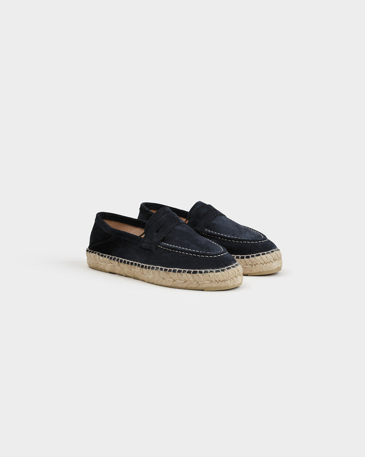 Black suede loafers with woven espadrille sole and white stitching