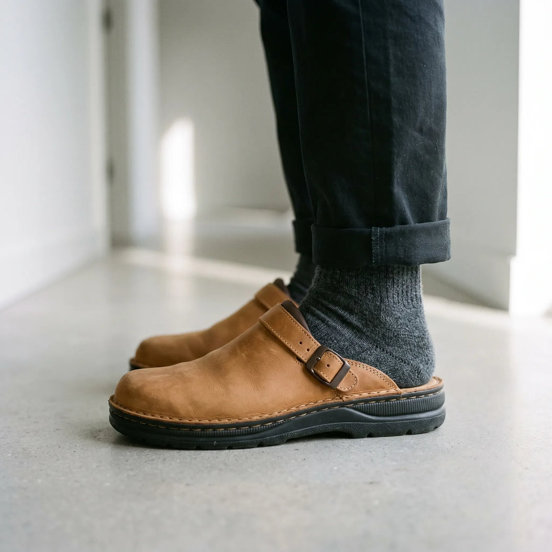Men's closed-toe mule shoes with buckle strap and flat sole