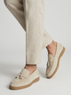 Beige men's tassel loafers with moc toe and low brown sole
