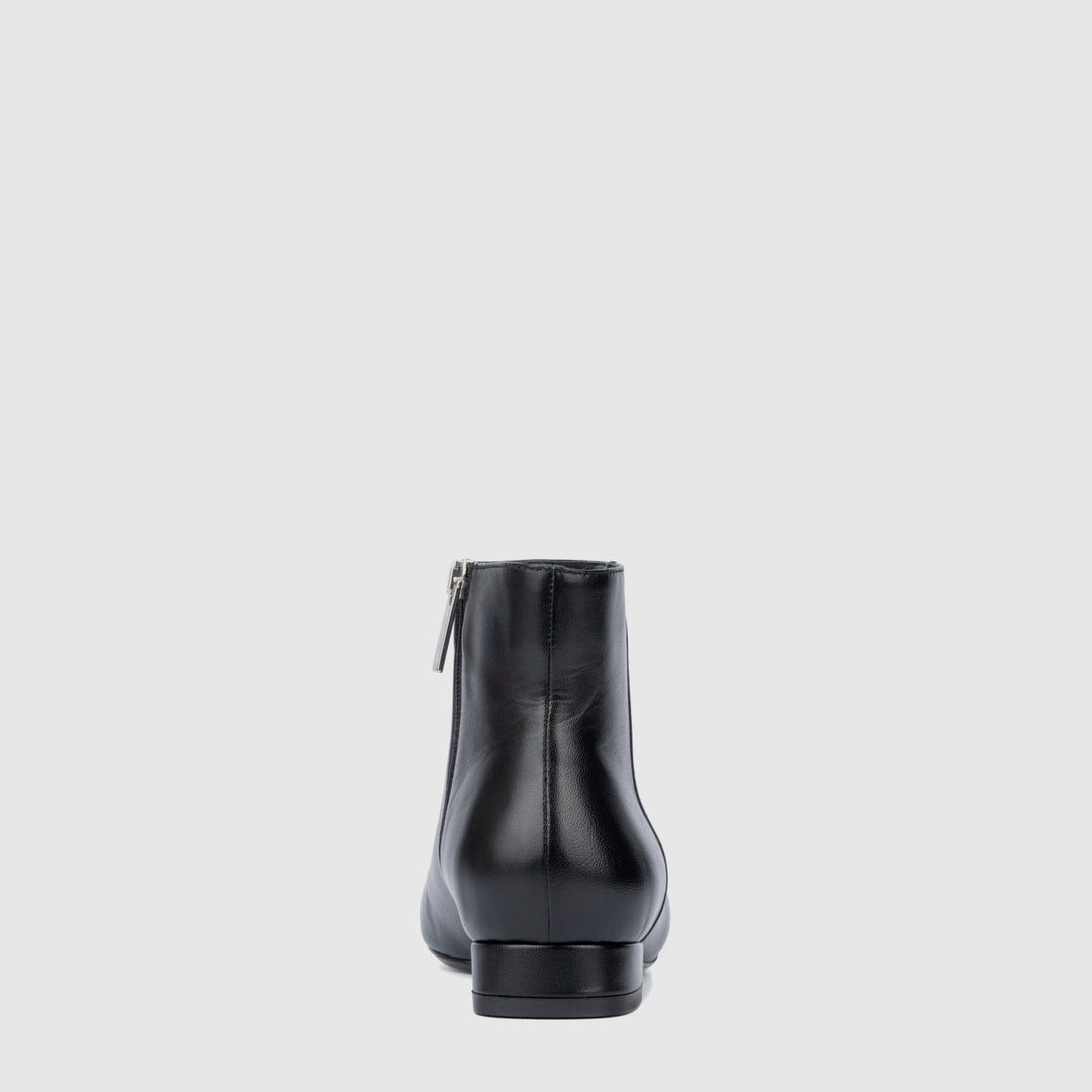 Women's black pointed toe ankle boots with side zips and low heels