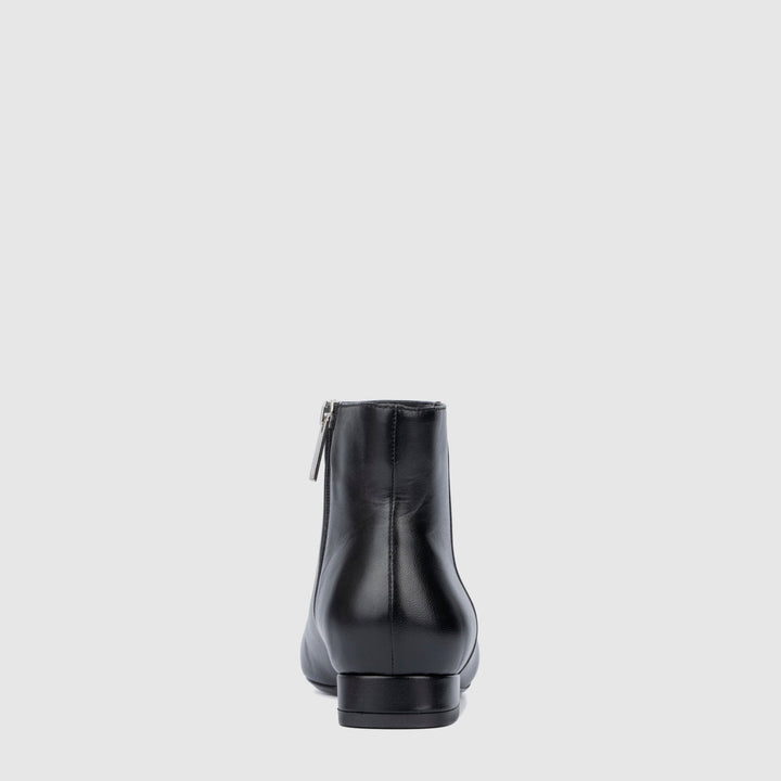 Women's black pointed toe ankle boots with side zips and low heels