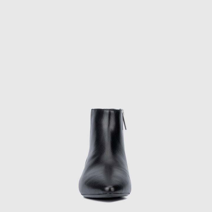 Women's black pointed toe ankle boots with side zips and low heels