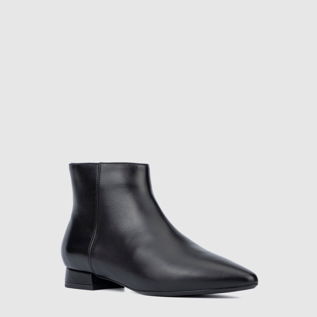 Women's black pointed toe ankle boots with side zips and low heels