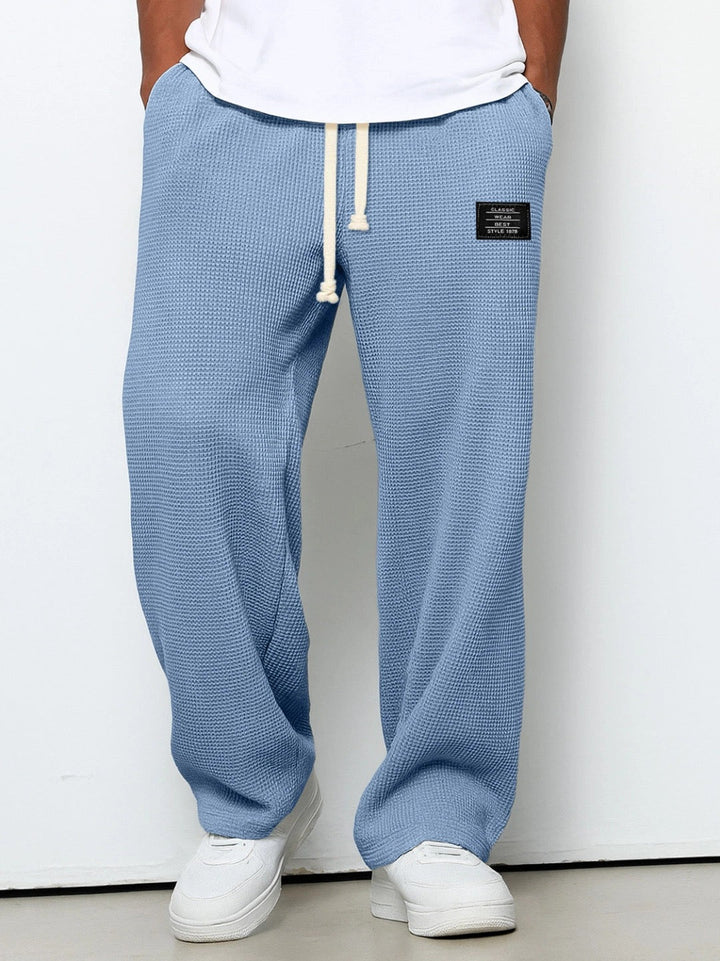 Men's wide-leg trousers with drawstring waist and textured finish