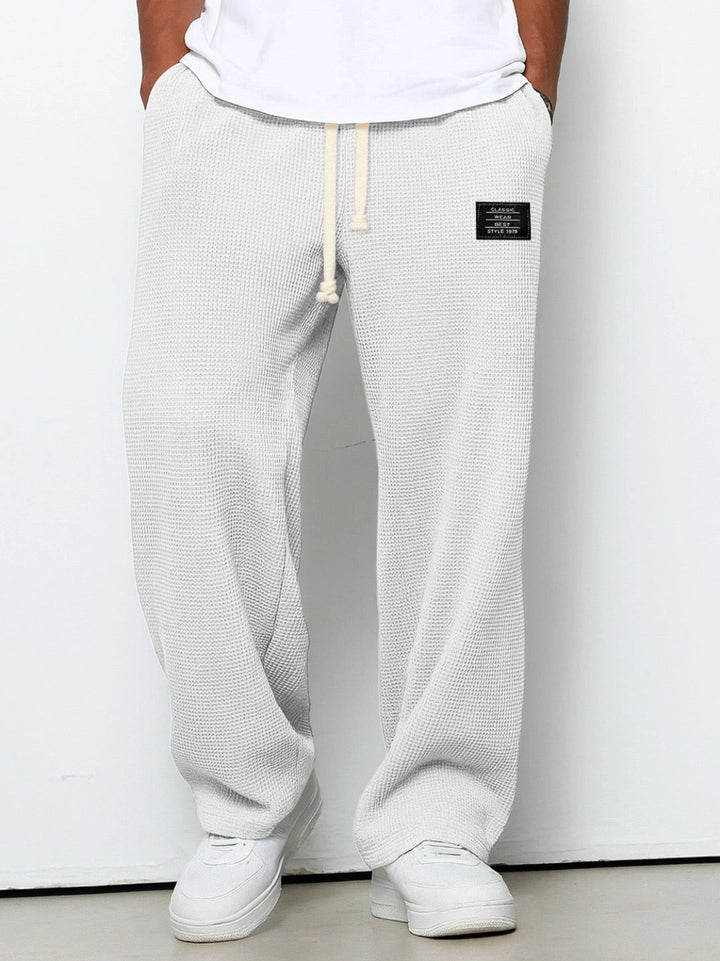 Men's wide-leg trousers with drawstring waist and textured finish