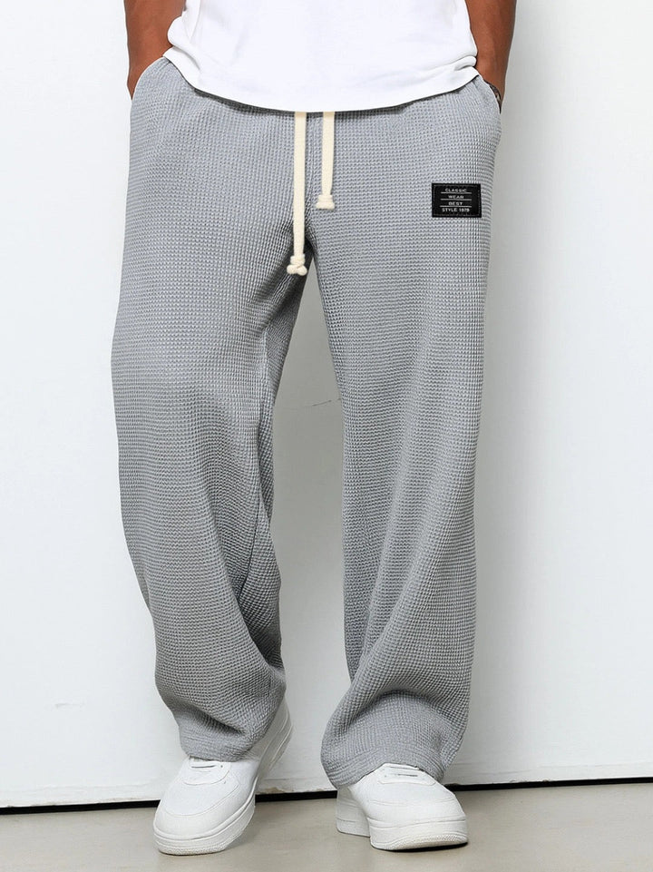 Men's wide-leg trousers with drawstring waist and textured finish