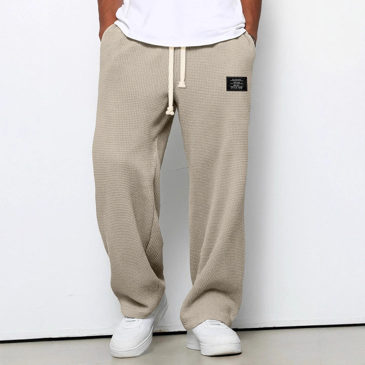 Men's wide-leg trousers with drawstring waist and textured finish