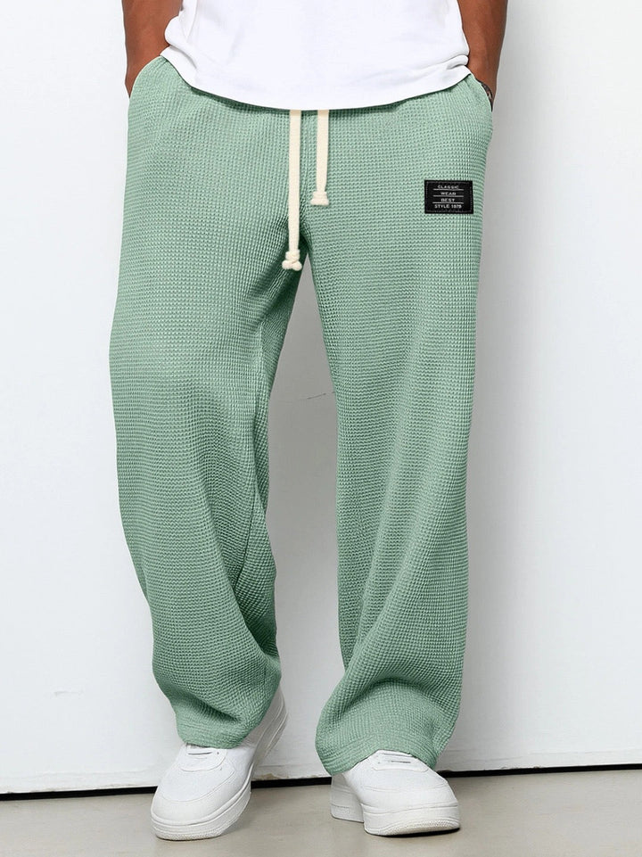 Men's wide-leg trousers with drawstring waist and textured finish
