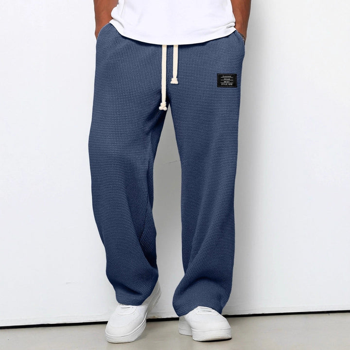 Men's wide-leg trousers with drawstring waist and textured finish