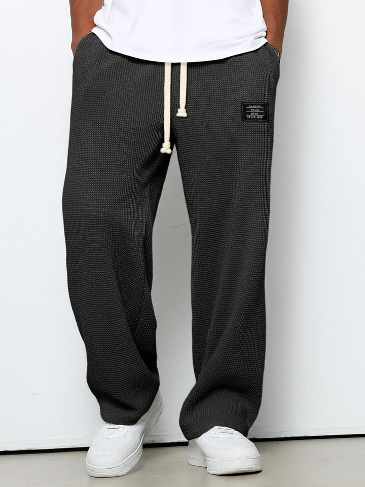 Men's wide-leg trousers with drawstring waist and textured finish