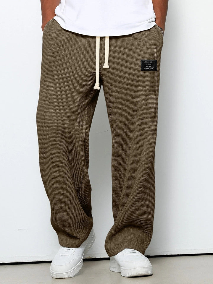 Men's wide-leg trousers with drawstring waist and textured finish
