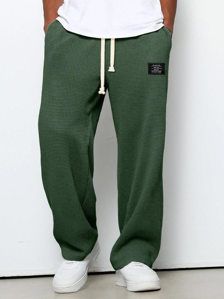 Men's wide-leg trousers with drawstring waist and textured finish