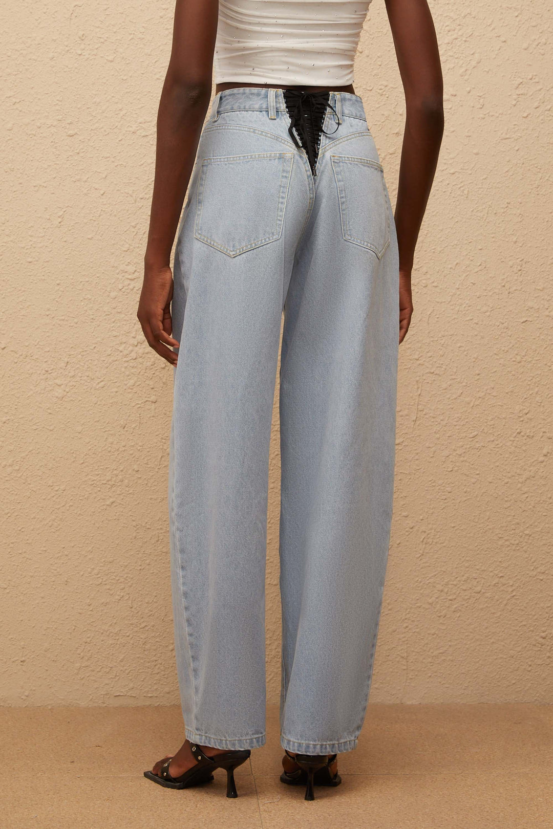 Women's light blue high-rise wide leg jeans with front and rear pockets