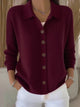 Women's collared button-front cardigan with long sleeves and ribbed trims