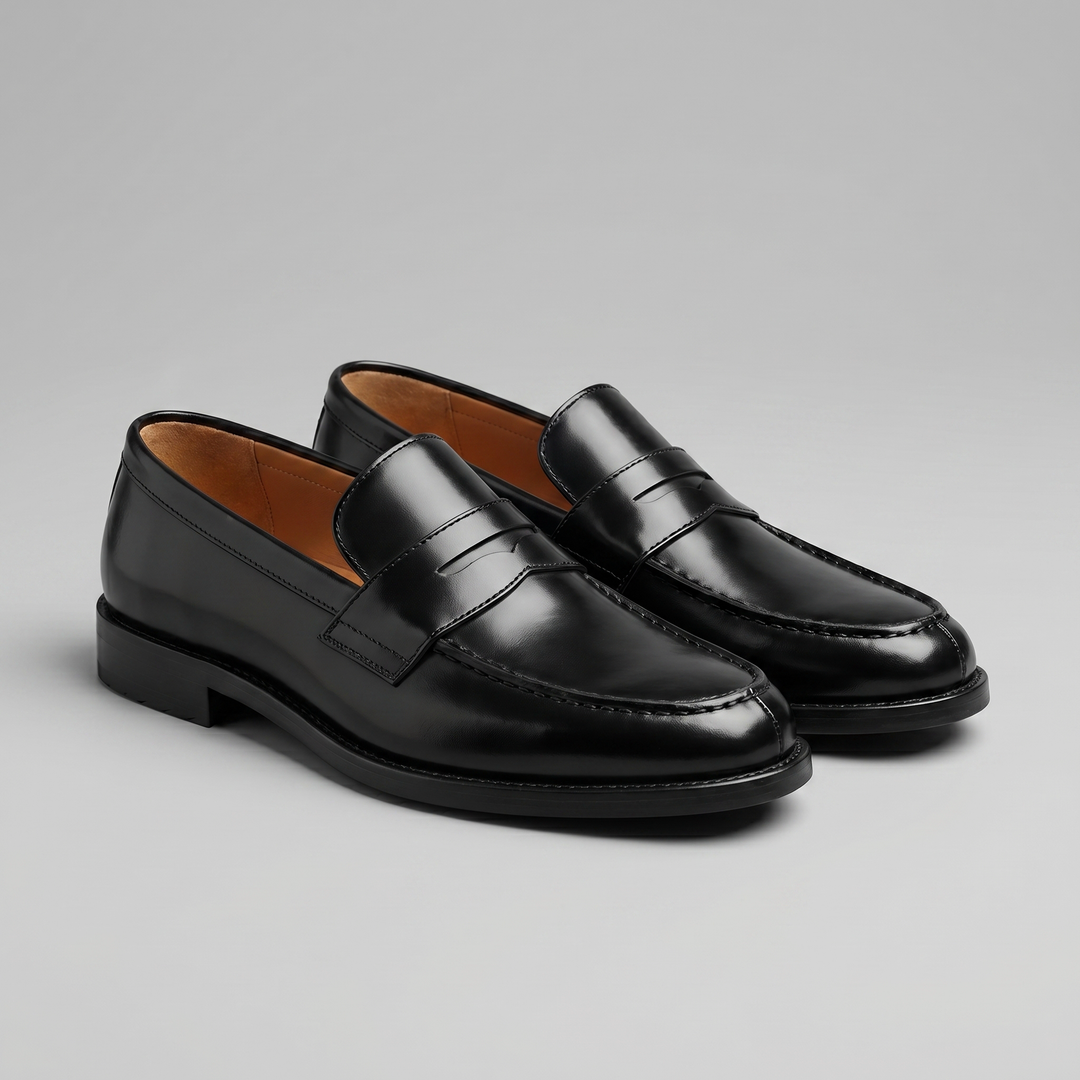 Men's black glossy penny loafers with rounded toes and low heels