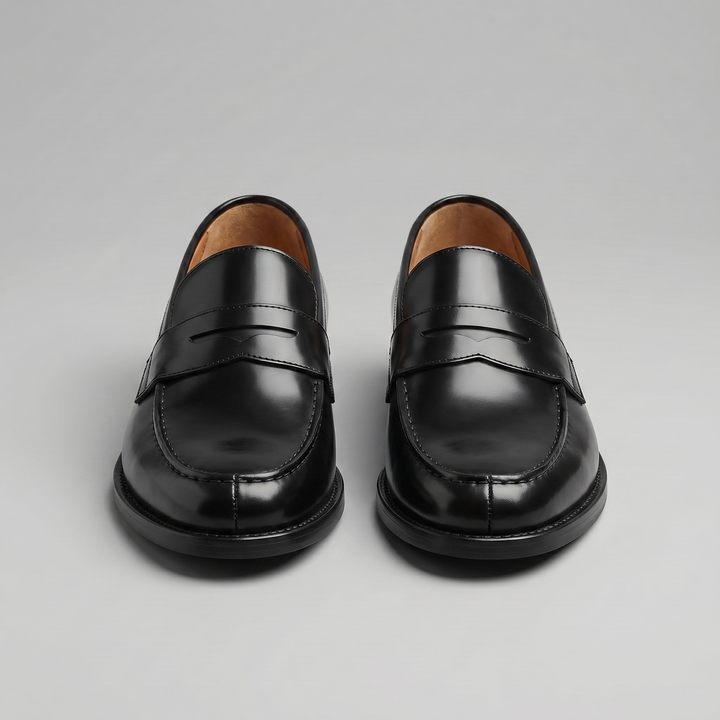Men's black glossy penny loafers with rounded toes and low heels