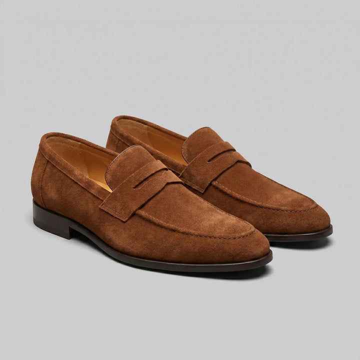 Men's penny loafers with almond toes, front straps and low flat heels