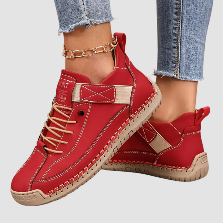 Women's lace-up sneakers with stitched panels and flat textured soles