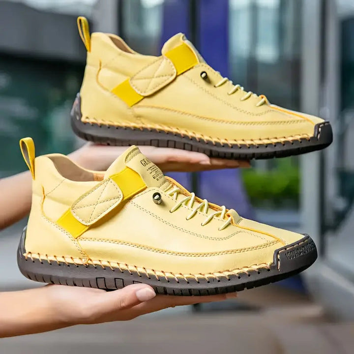 Women's lace-up sneakers with stitched panels and flat textured soles
