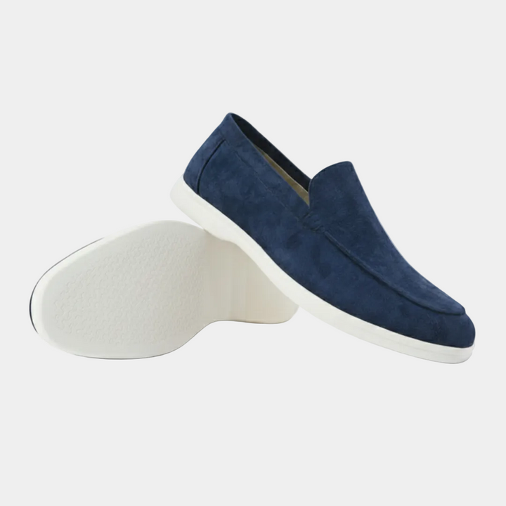 Men's slip-on loafers with visible stitching and white flat soles