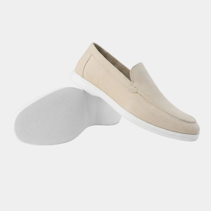 Men's slip-on loafers with visible stitching and white flat soles