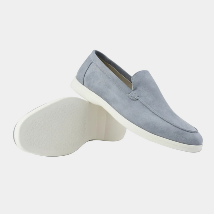 Men's slip-on loafers with visible stitching and white flat soles