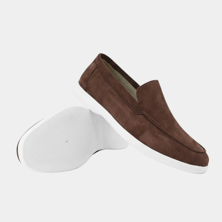 Men's slip-on loafers with visible stitching and white flat soles