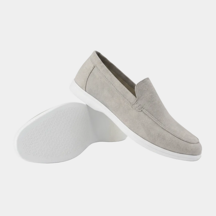 Men's slip-on loafers with visible stitching and white flat soles