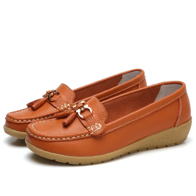 Women's slip-on loafers with tassel and metal details