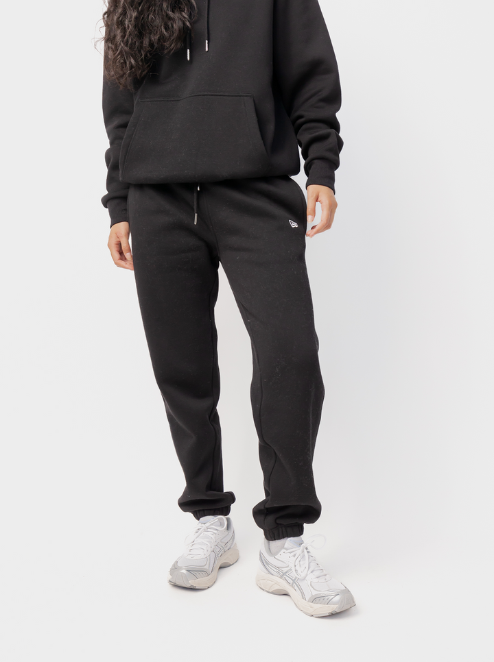 Women's black fleece jogger pants with logo detail and cuffed hems