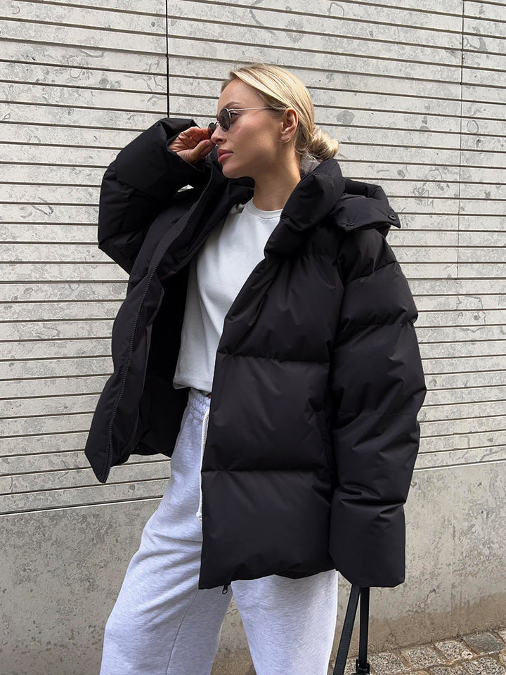 Women's oversized hooded puffer jacket with quilted panels