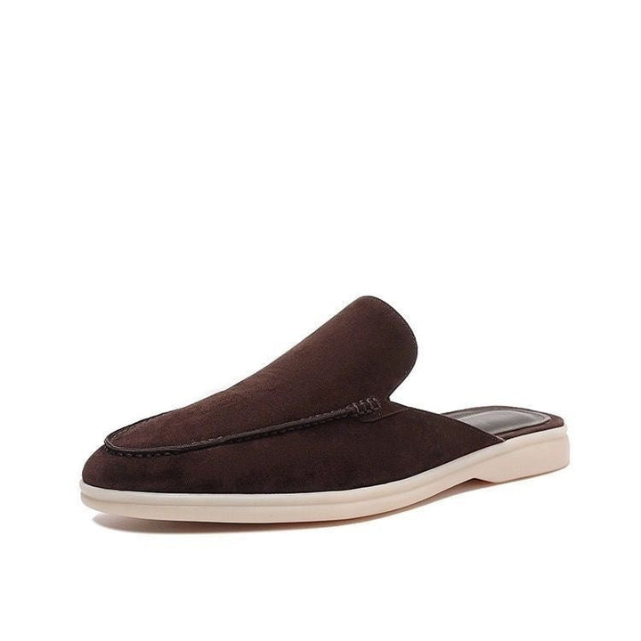 Black loafer mule with cream platform sole, open heel slip-on design