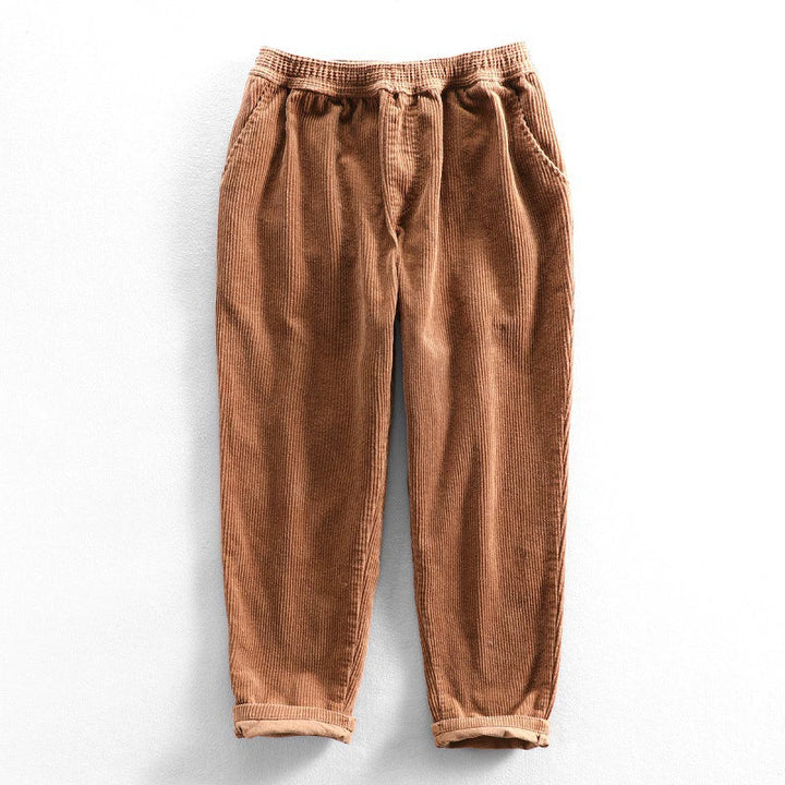 Men's ribbed corduroy pants with tapered legs and cuffed hems