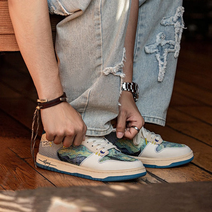 Low-top sneakers with abstract scenic artwork panels and blue soles
