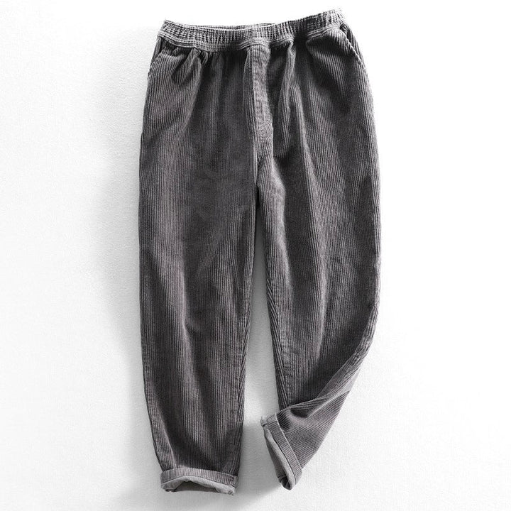 Men's ribbed corduroy pants with tapered legs and cuffed hems