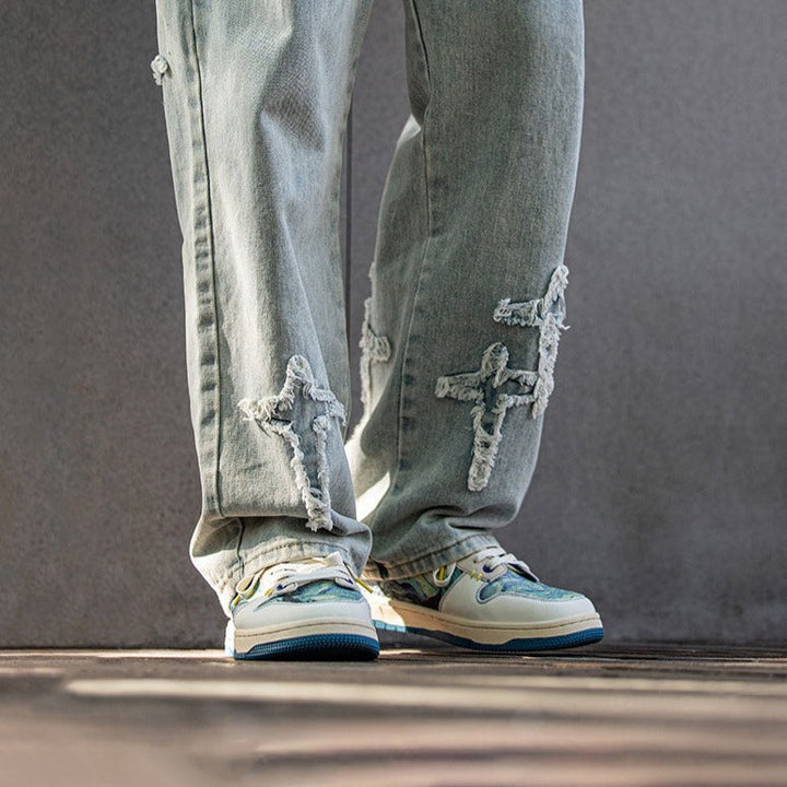 Low-top sneakers with abstract scenic artwork panels and blue soles