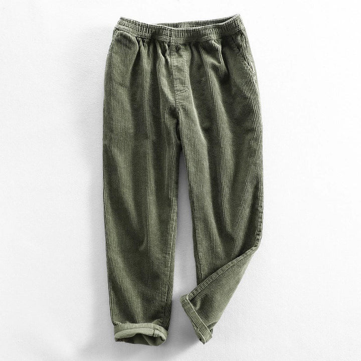 Men's ribbed corduroy pants with tapered legs and cuffed hems
