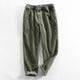 Men's ribbed corduroy pants with tapered legs and cuffed hems