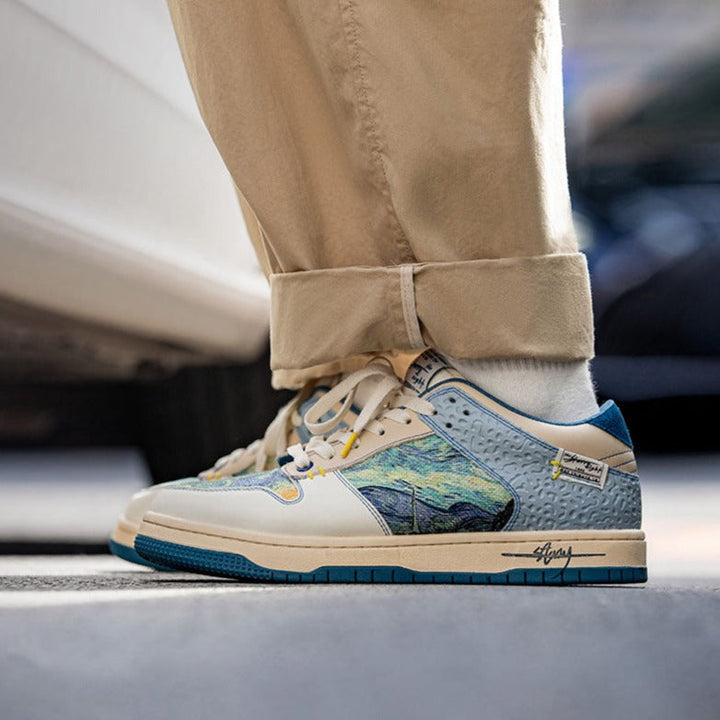 Low-top sneakers with abstract scenic artwork panels and blue soles