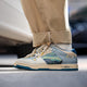 Low-top sneakers with abstract scenic artwork panels and blue soles