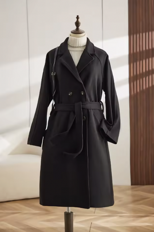 Women's long belted trench coat with lapels and button fastening