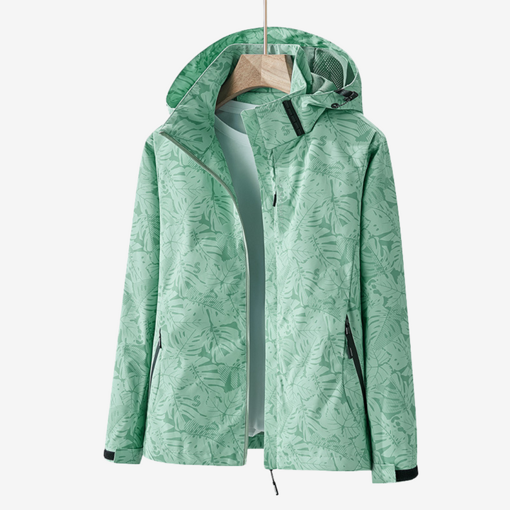 Women's hooded leaf print windbreaker jacket with zipped pockets