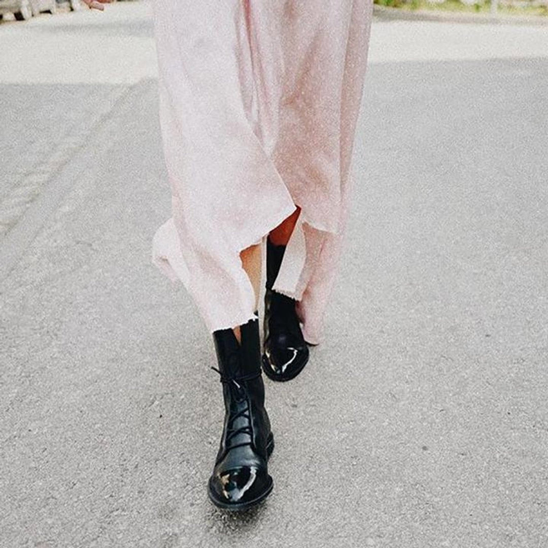 Women's lace-up boots with tall shafts, cap toe panels and low heels