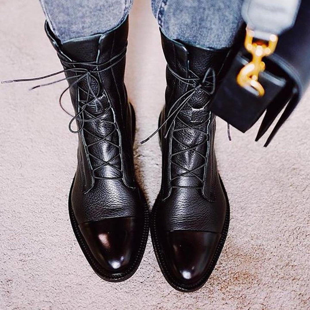 Women's lace-up boots with tall shafts, cap toe panels and low heels