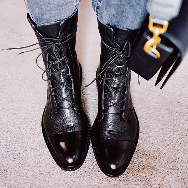 Women's lace-up boots with tall shafts, cap toe panels and low heels