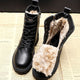 Women's black winter lace-up boots with visible faux fur lining