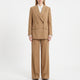 Women's tan double-breasted trouser suit with wide-leg trousers